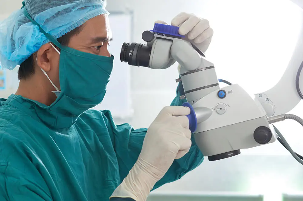 Experienced cataract surgeon preparing for eye surgery