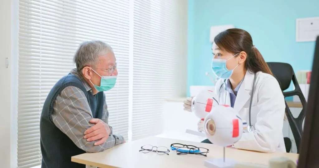 Eye doctor explaining types of cataract to a patient