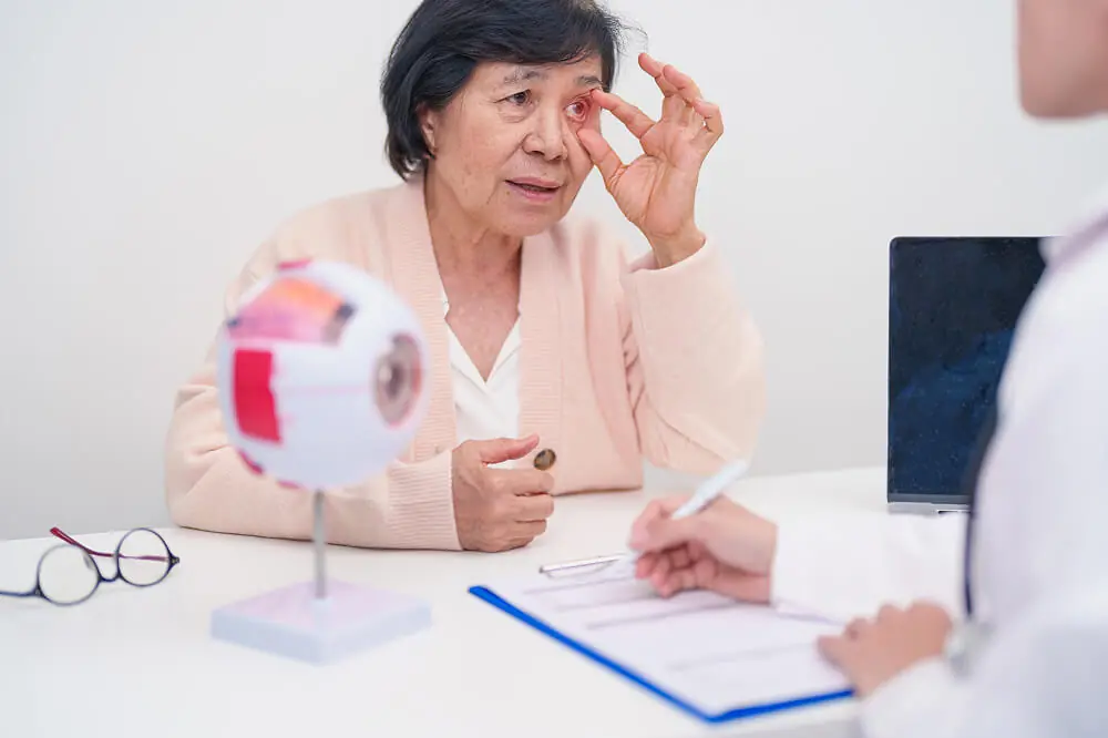 Patient asking an eye specialist questions before cataract surgery